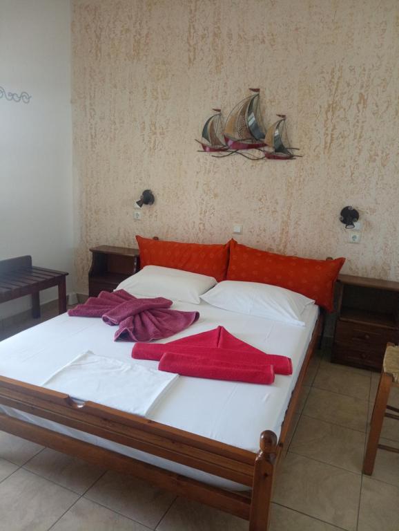 A bed or beds in a room at Nektaria on the Beach