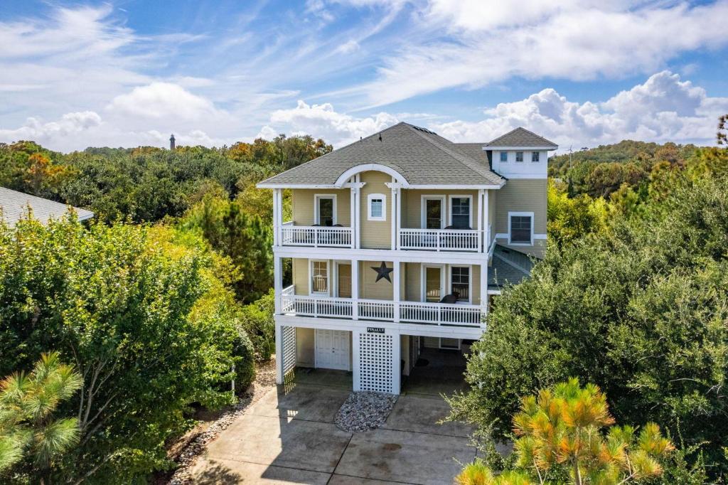 an aerial view of a house with trees at VOH151 FINALLY in Corolla