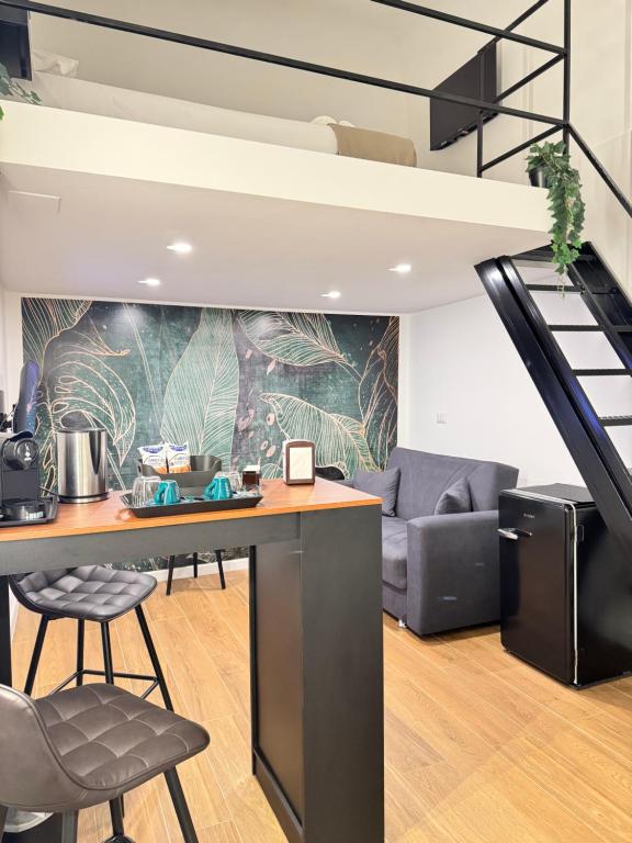 a living room with a table and a couch at Luxury apartment - La fenice in Bari