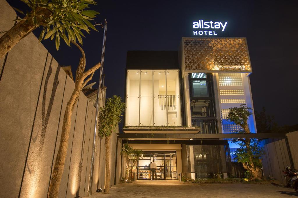 a building with a sign that reads alley hotel at Allstay Ecotel Yogyakarta in Yogyakarta