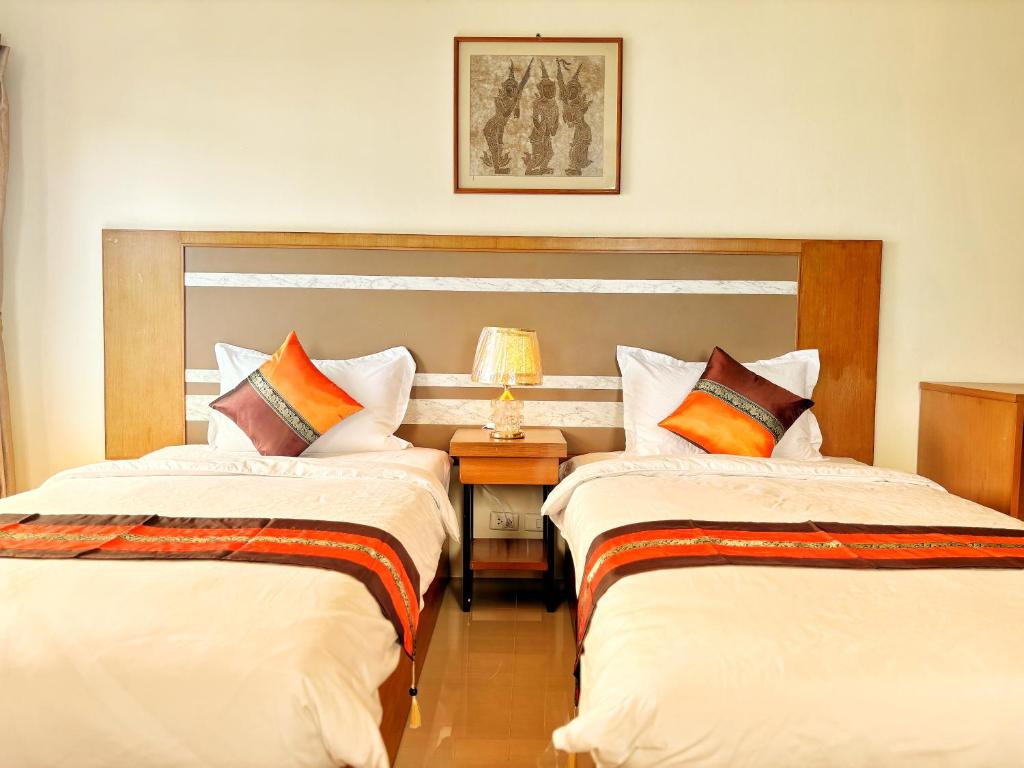Postel nebo postele na pokoji v ubytování patong v hotel