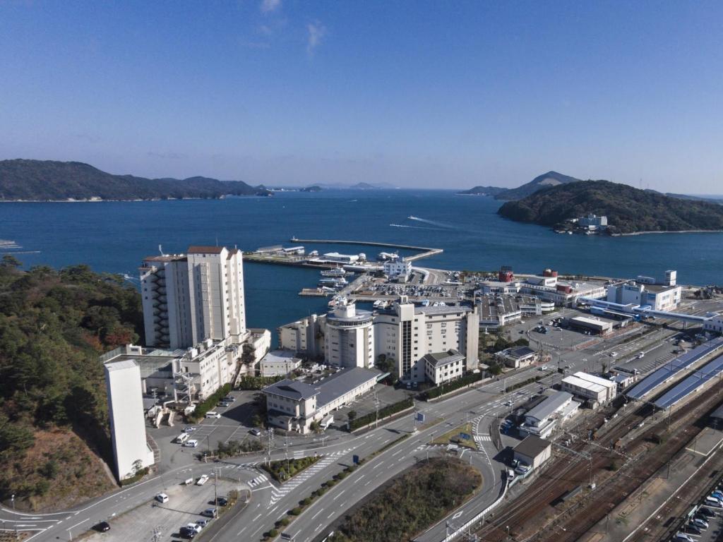 an aerial view of a city and the water at Todaya in Toba