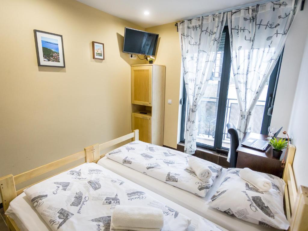 Postel nebo postele na pokoji v ubytování Hostel Moving