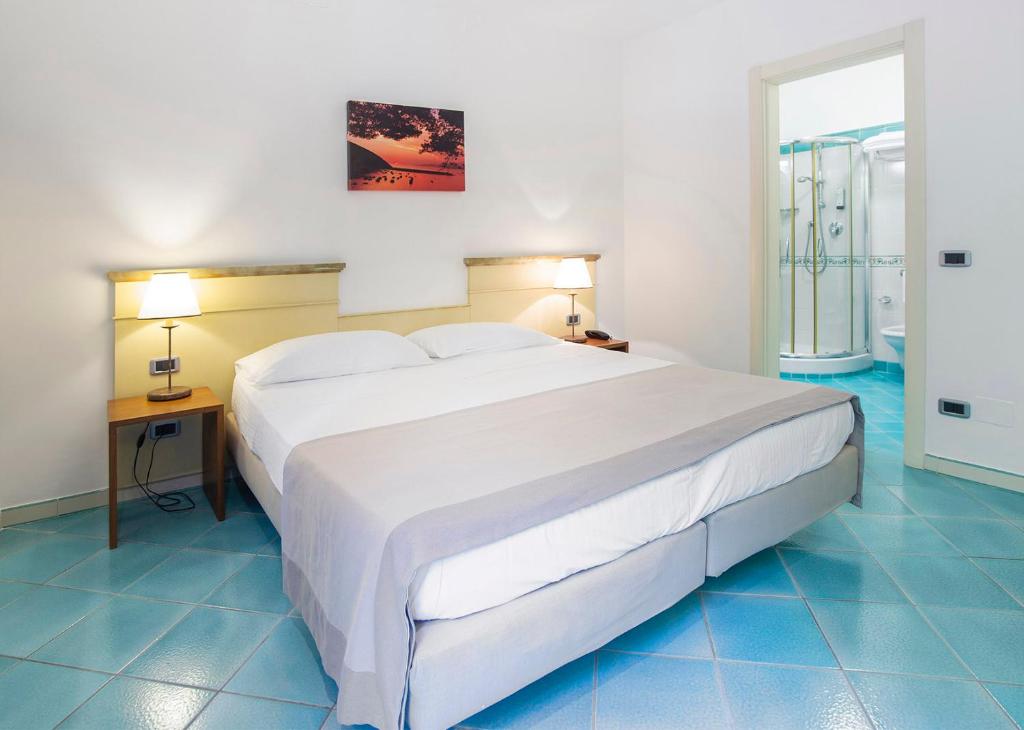 Postel nebo postele na pokoji v ubytování Hotel La Torre
