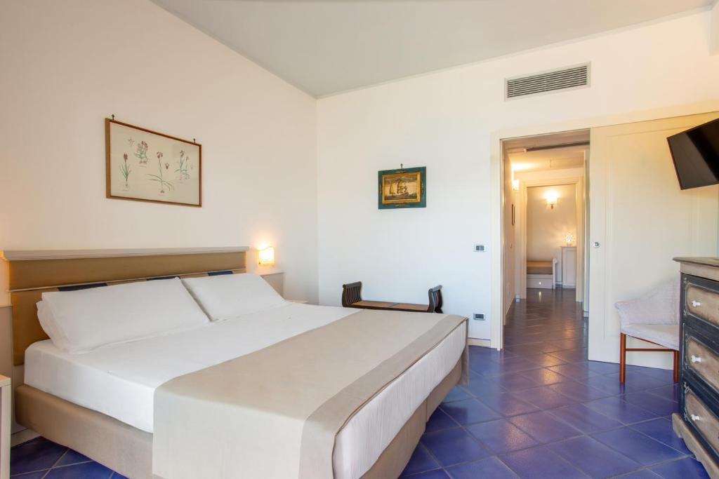 Postel nebo postele na pokoji v ubytování Hotel La Torre