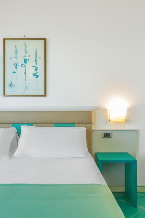 Postel nebo postele na pokoji v ubytování Hotel La Torre