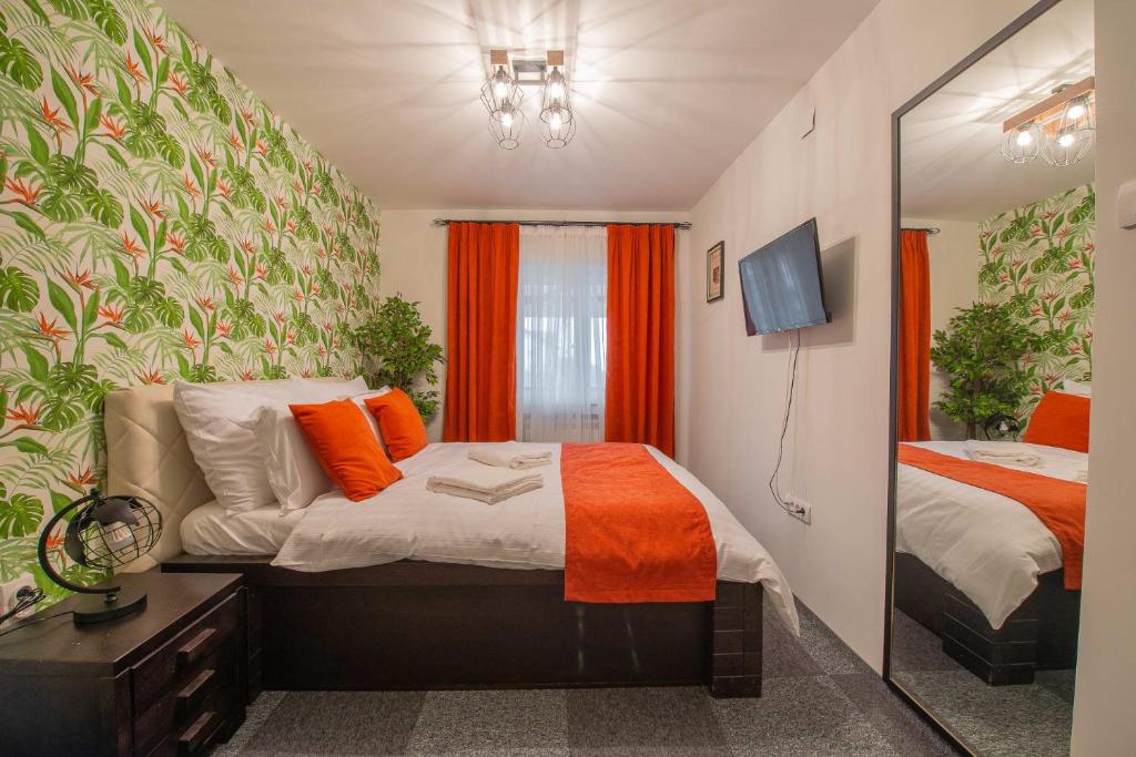Postel nebo postele na pokoji v ubytování Apartmani Maximilian