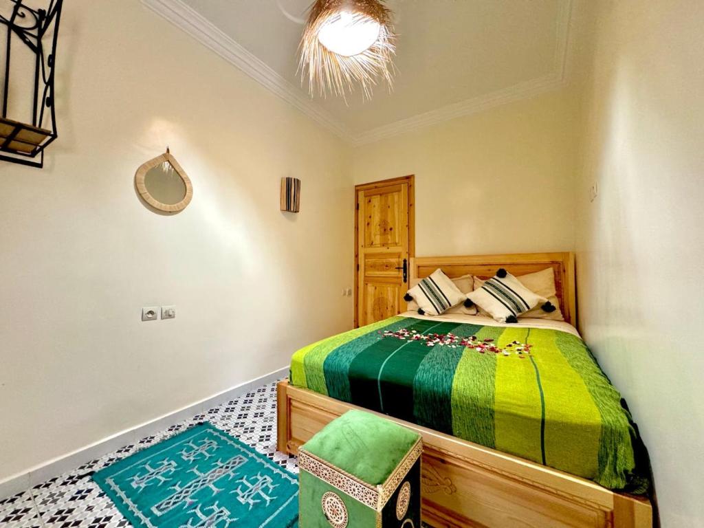 Postel nebo postele na pokoji v ubytování Riad Rayan