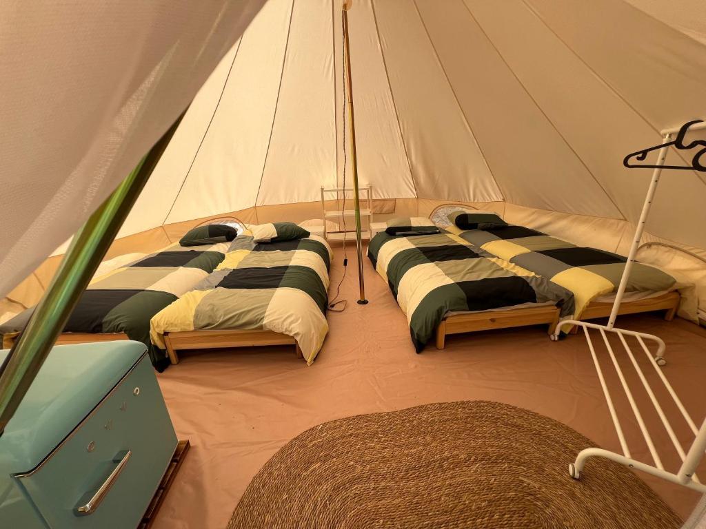 Postel nebo postele na pokoji v ubytování Camping BOSQUE DE G0RD0N