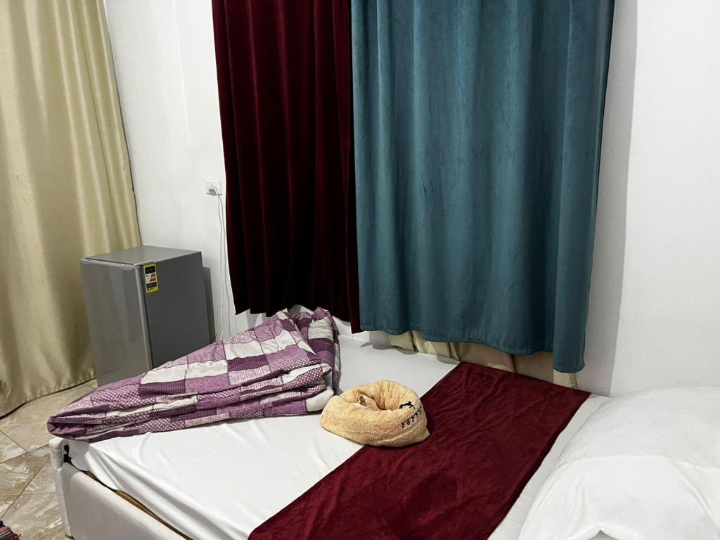 Postel nebo postele na pokoji v ubytování Jana Pyramids view inn