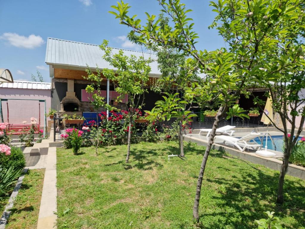 a garden with trees and a swimming pool at Garden Gabala-Villa1 in Gabala