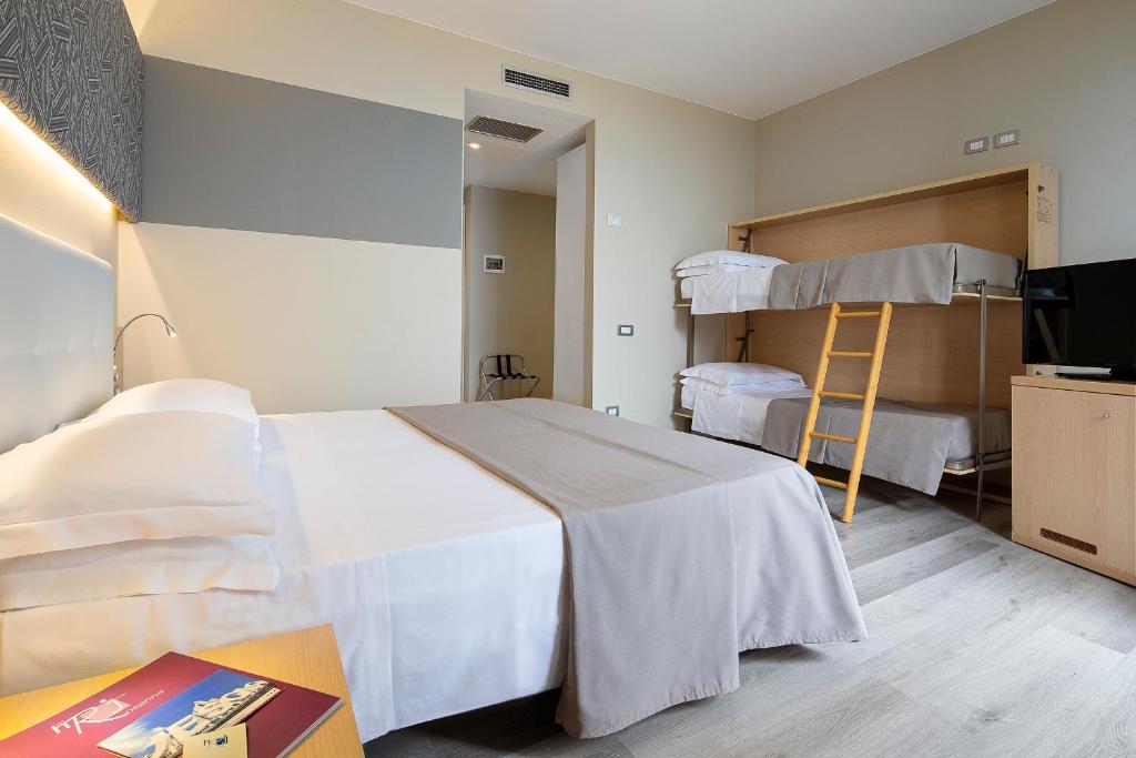 Postel nebo postele na pokoji v ubytování Hotel Rosanna 3 Stelle Superior