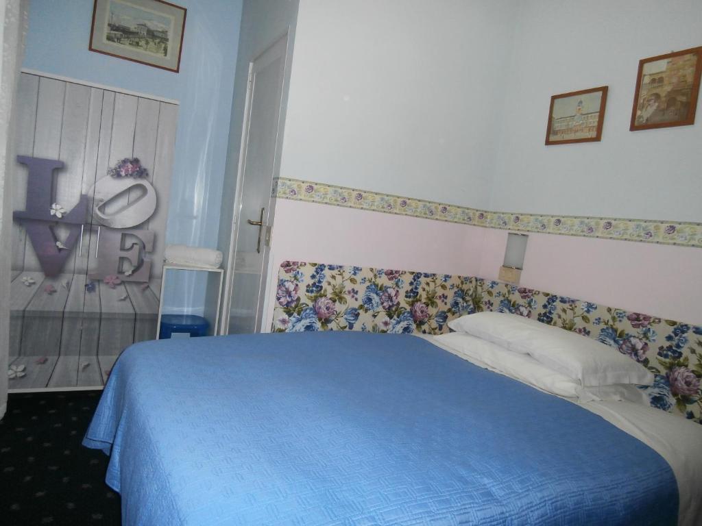 Postel nebo postele na pokoji v ubytování Albergo Junior
