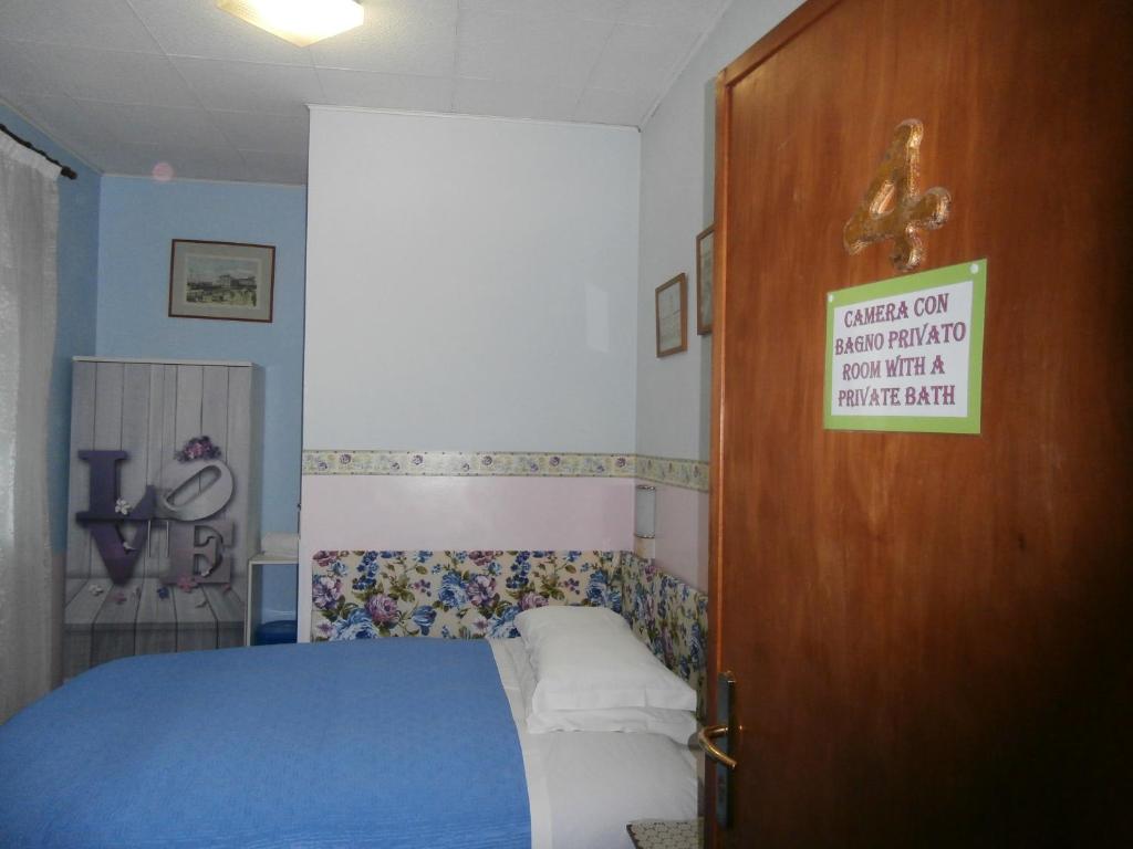 Postel nebo postele na pokoji v ubytování Albergo Junior