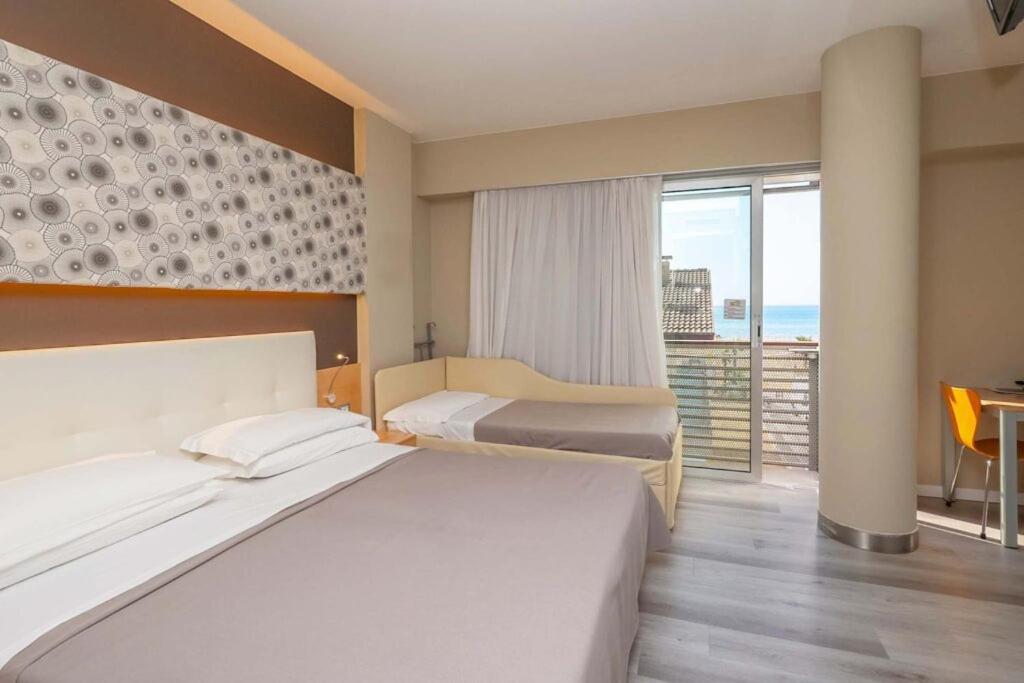 Postel nebo postele na pokoji v ubytování Hotel Rosanna 3 Stelle Superior