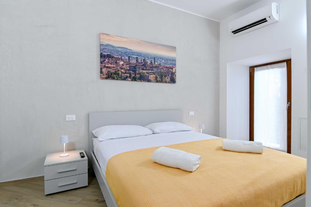 Postel nebo postele na pokoji v ubytování La Corte di Scanzo - Luxury and Charm