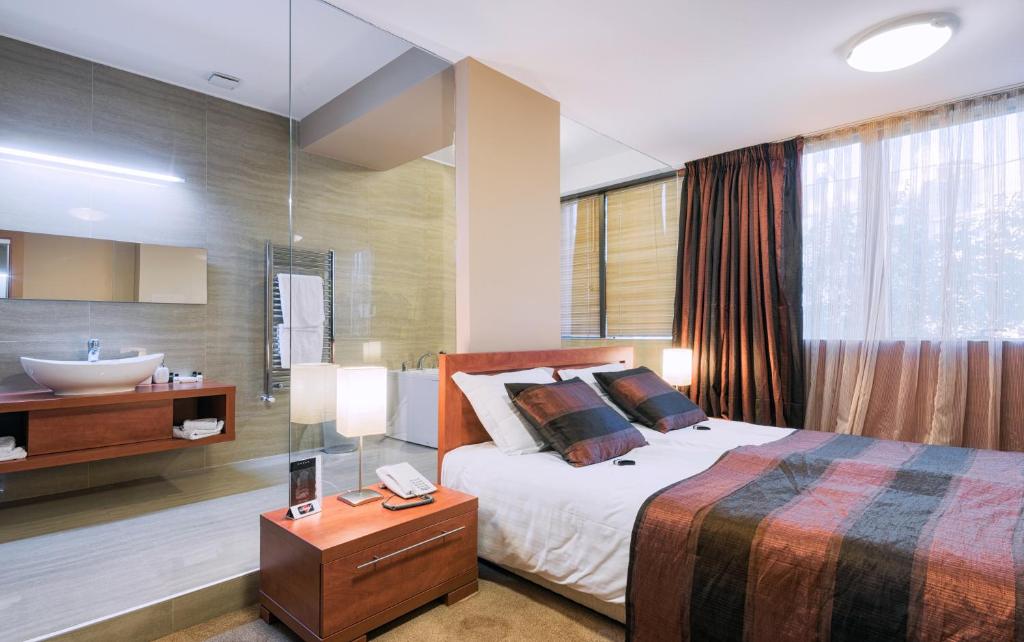 Postel nebo postele na pokoji v ubytování Hotel Arka