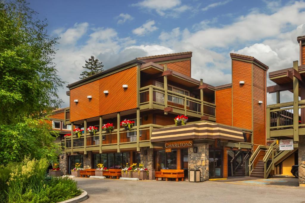 a large orange building with flowers on the balconies at Charltons Banff in Banff