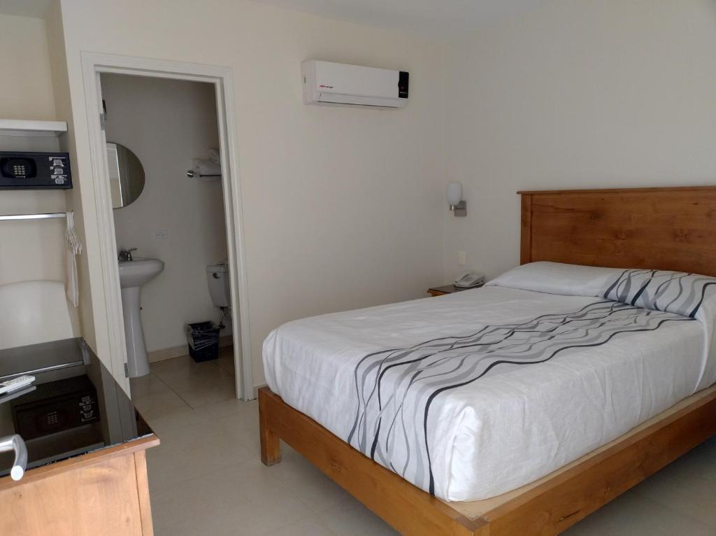 Postel nebo postele na pokoji v ubytování Hotel Baja