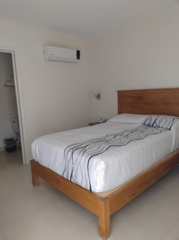 Postel nebo postele na pokoji v ubytování Hotel Baja
