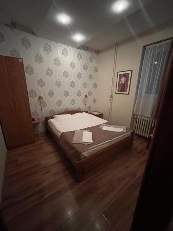 Postel nebo postele na pokoji v ubytování Hotel Dulovic