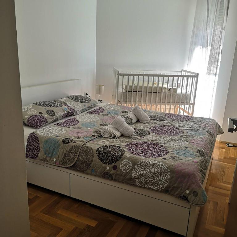 Postel nebo postele na pokoji v ubytování Apartman Burinović