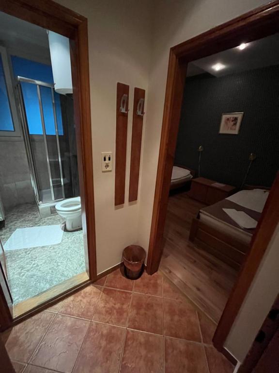 Postel nebo postele na pokoji v ubytování Hotel Dulovic