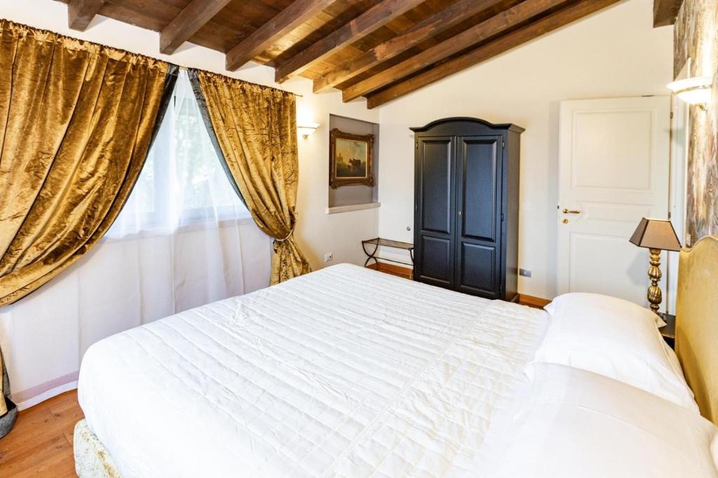 Postel nebo postele na pokoji v ubytování Corte Bioti