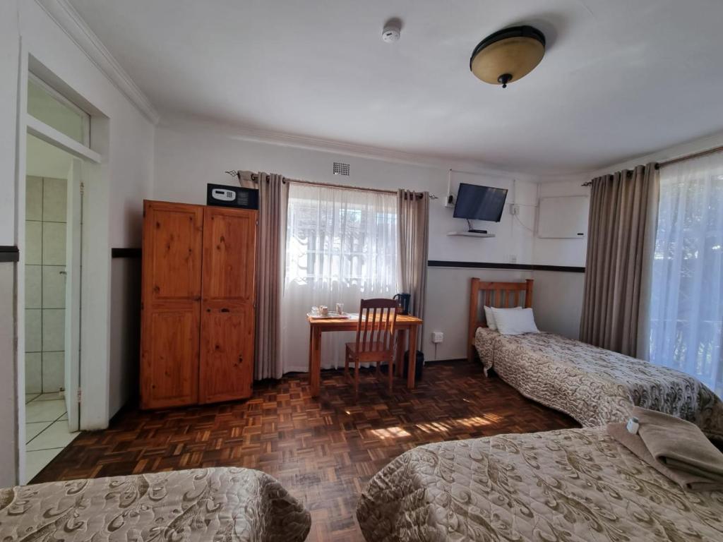 Postel nebo postele na pokoji v ubytování Emerald Guesthouse