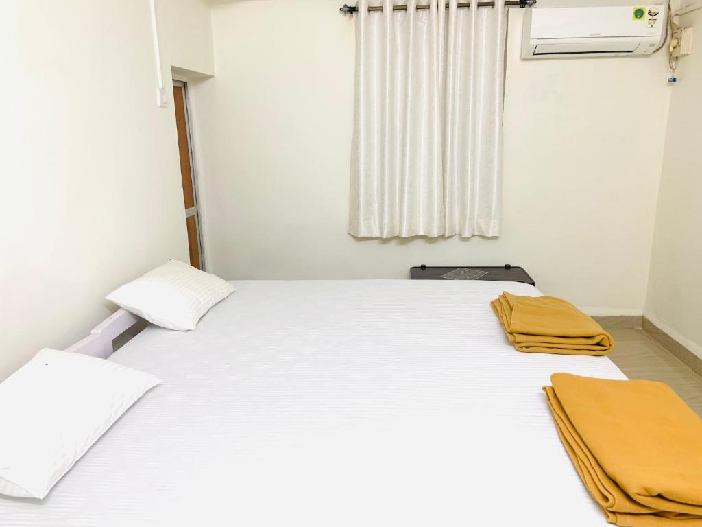 Postel nebo postele na pokoji v ubytování Palolem Paradise Guest House