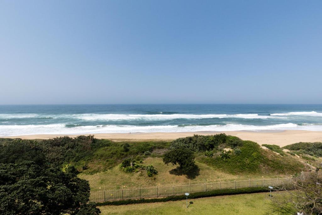 a view of a beach with the ocean in the background at Indigo Bay 33 in Margate