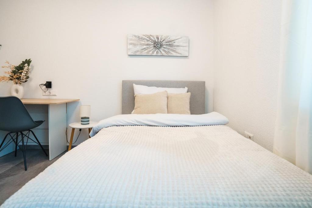 Postel nebo postele na pokoji v ubytování Hotel am Schafbaum