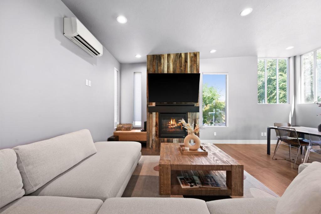 a living room with a couch and a fireplace at Minutes to Ski Resorts & Downtown, Yard, Fire Pit in Millcreek