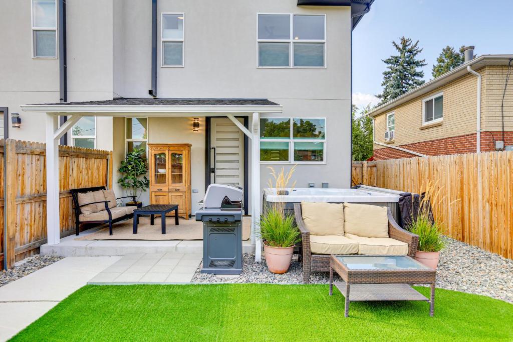 a backyard with a grill and a house at Hot Tub and Mtn-View Rooftop Deck Golden Home in Golden