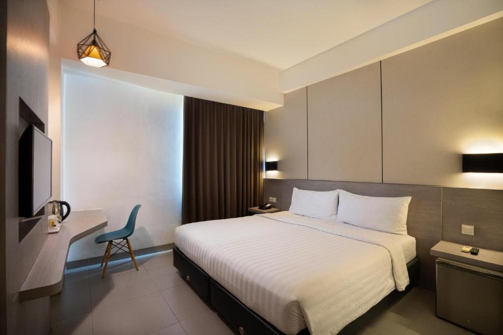 Postel nebo postele na pokoji v ubytování Laska Hotel Subang