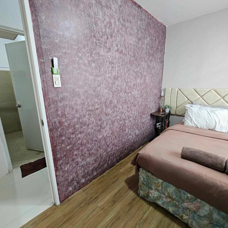 Postel nebo postele na pokoji v ubytování Davao City Airport Transient Rooms by Lemonique