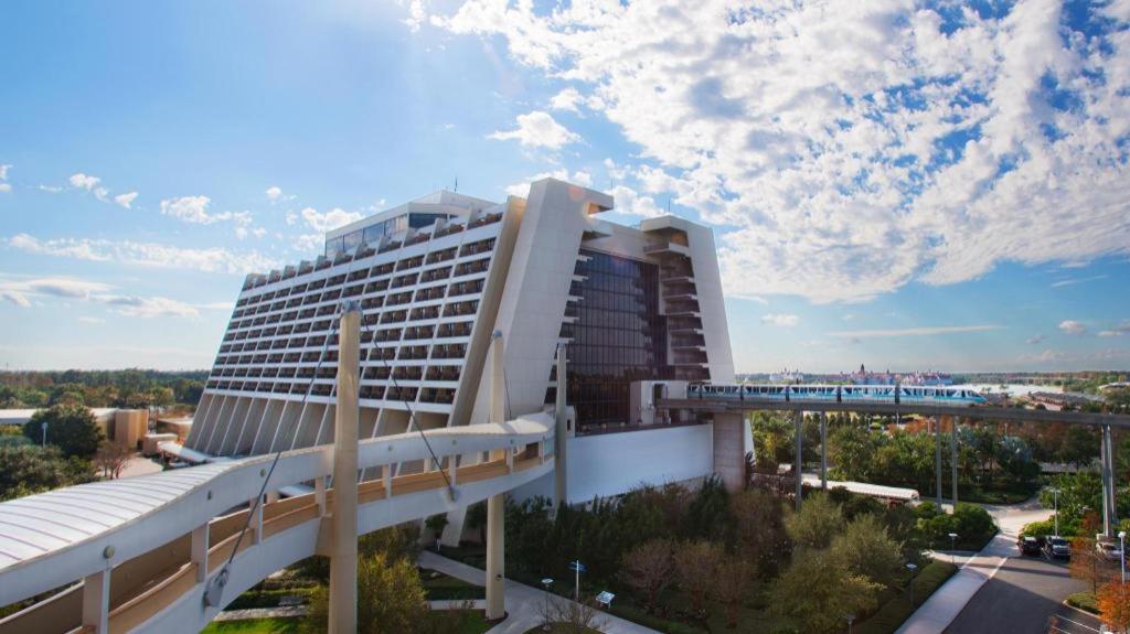 a large building with a train in front of it at Disney's Contemporary Resort in Orlando