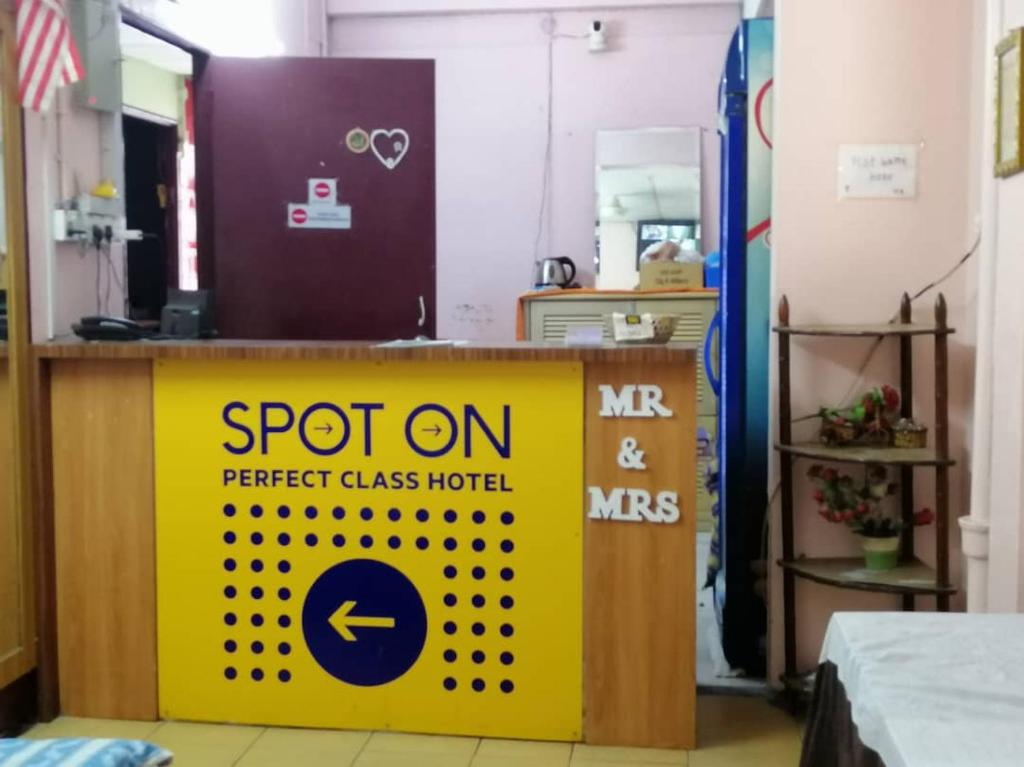 a sign that says spot on perfect class hotel at perfect class hotel in Kuala Lumpur