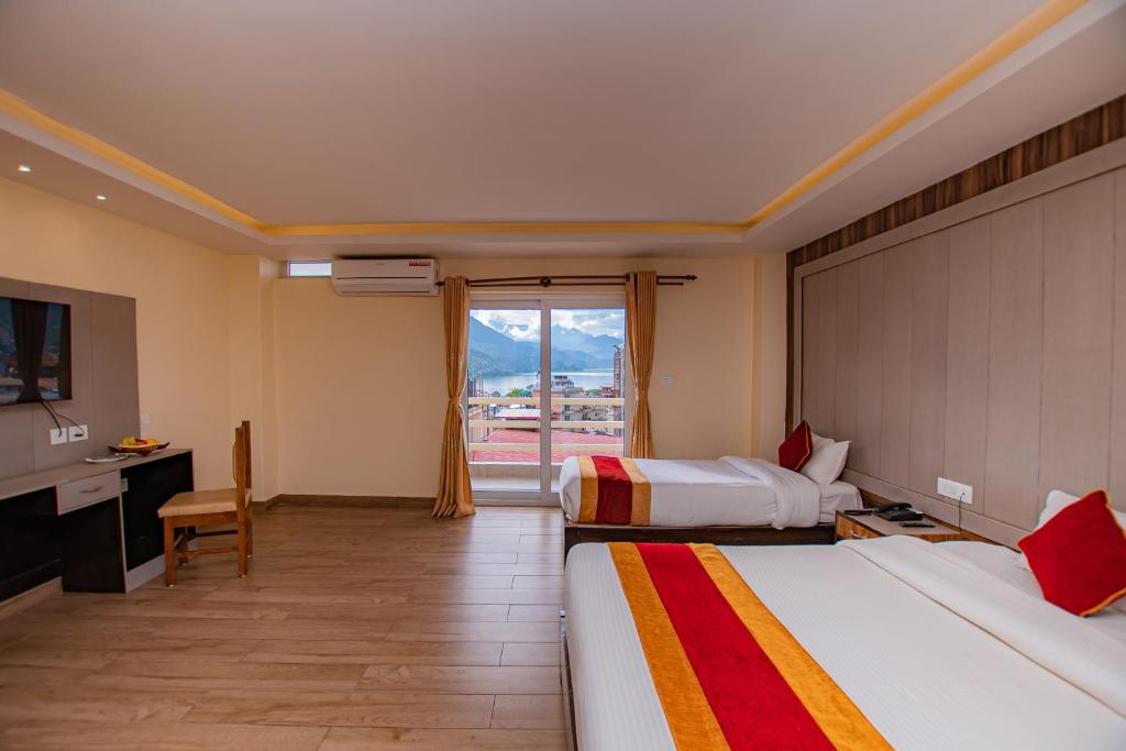 En eller flere senger på et rom på Hotel Murano