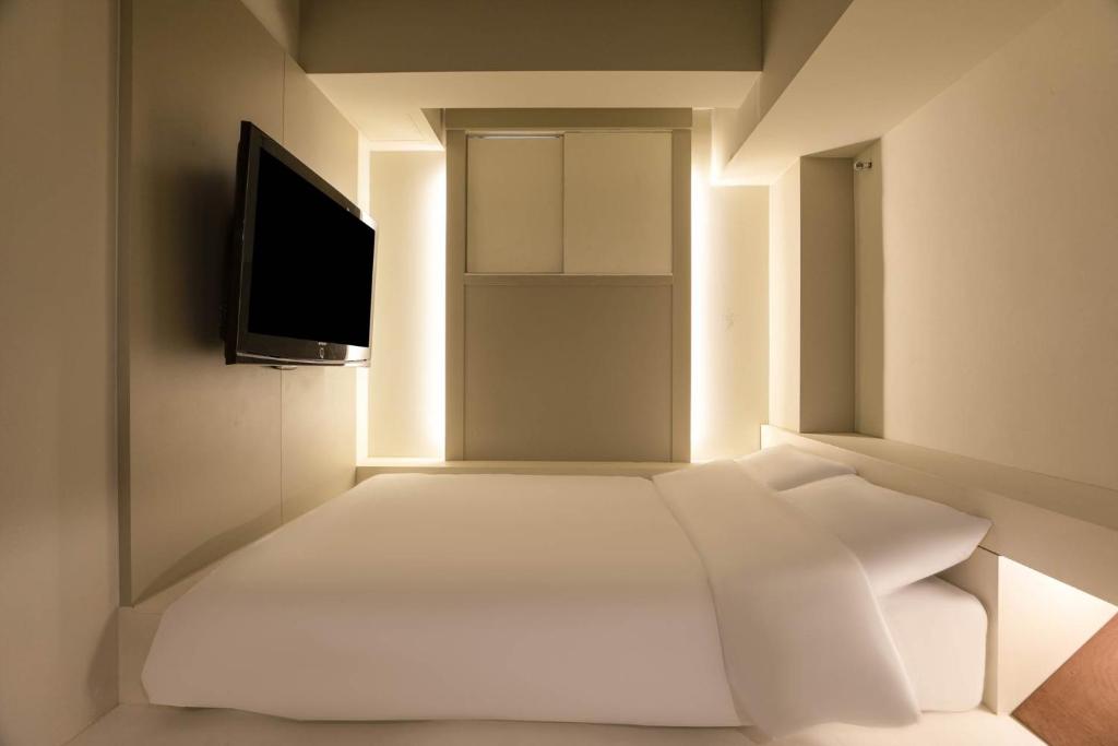 TV a/nebo společenská místnost v ubytování ADO hotel