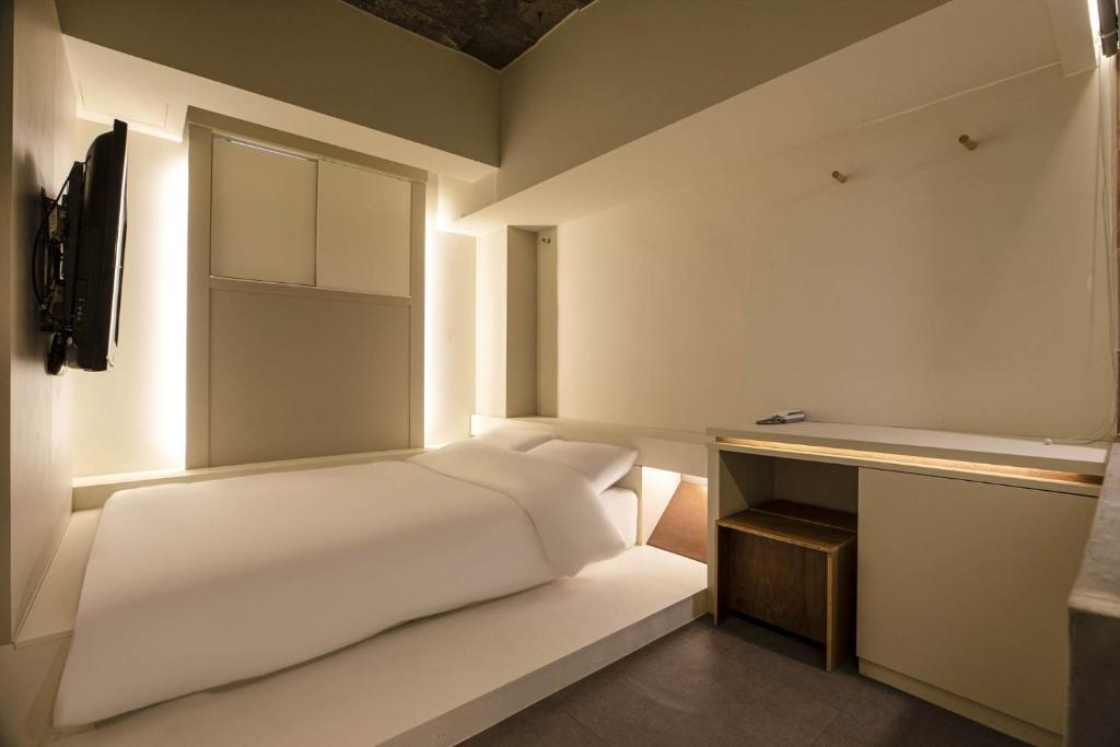 Postel nebo postele na pokoji v ubytování ADO hotel