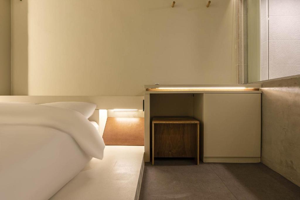 Postel nebo postele na pokoji v ubytování ADO hotel