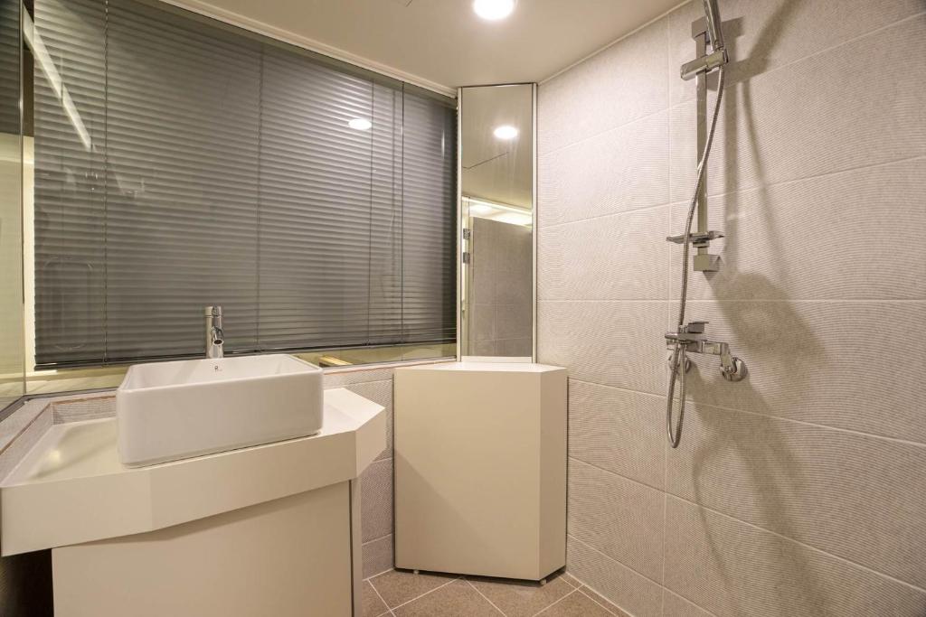 Koupelna v ubytování ADO hotel