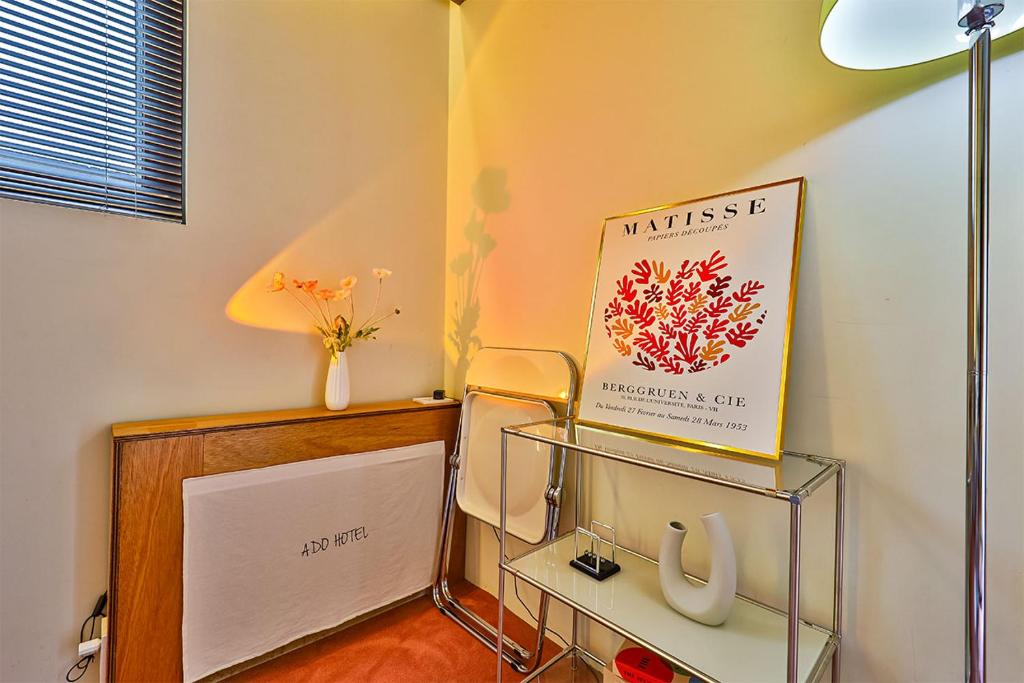 Postel nebo postele na pokoji v ubytování ADO hotel