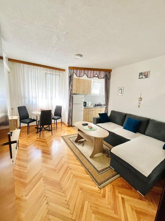 a living room with a couch and a table at Apartment Sara in Mostar