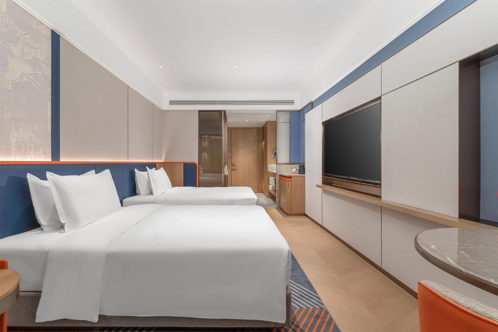 Postel nebo postele na pokoji v ubytování Holiday Inn Express Datong Pingcheng by IHG