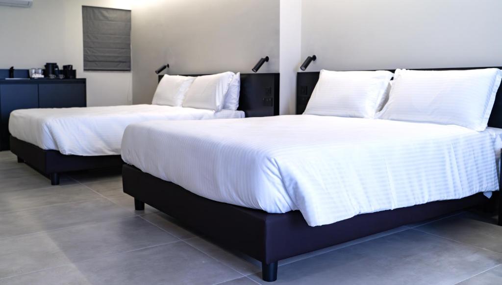 Postel nebo postele na pokoji v ubytování Onyx Hotel