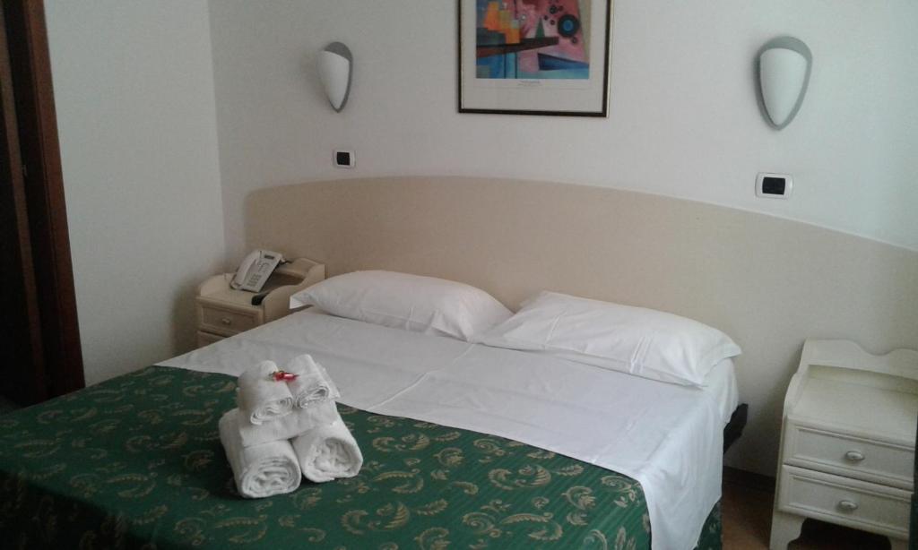 Łóżko lub łóżka w pokoju w obiekcie Hotel La Palazzina