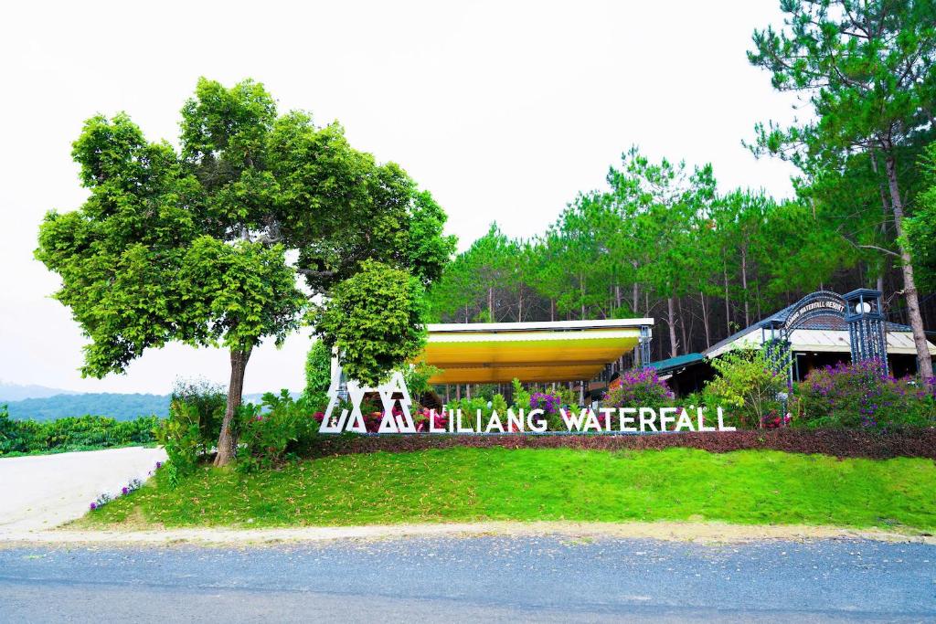 a park with a sign that says aliking watermill at KDL Liliang in Di Linh