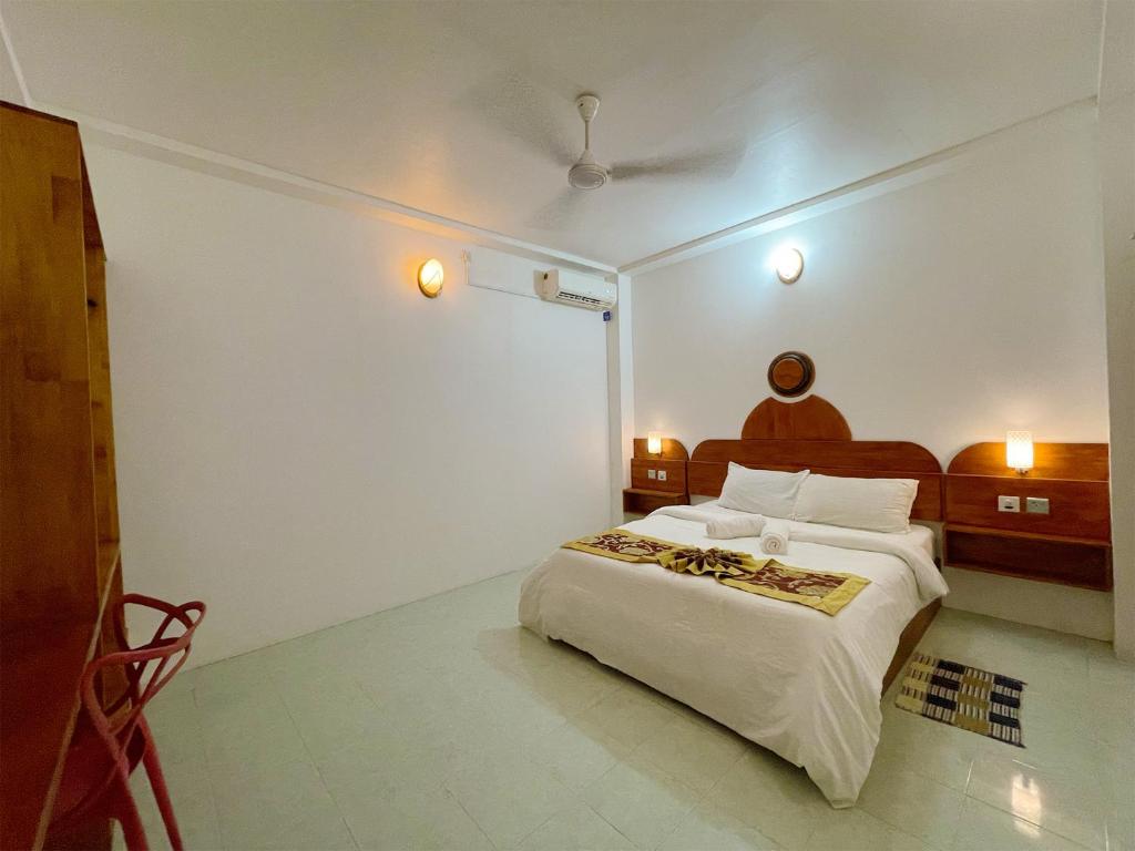 Postel nebo postele na pokoji v ubytování Paradise Retreat, Maafushi